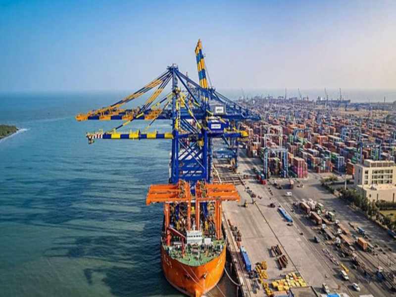 Aerial view of advanced port infrastructure in India showing high-capacity container terminals and ship-to-shore cranes, illustrating the Maritime India Vision 2030 modernization goals.