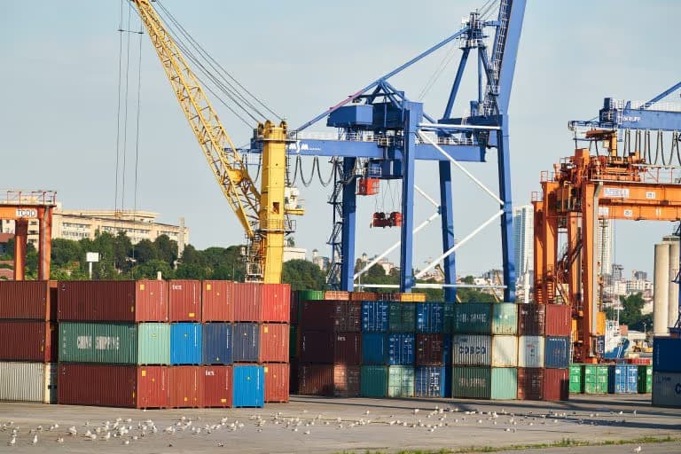 Buyer and seller negotiating an export contract with documents on the table